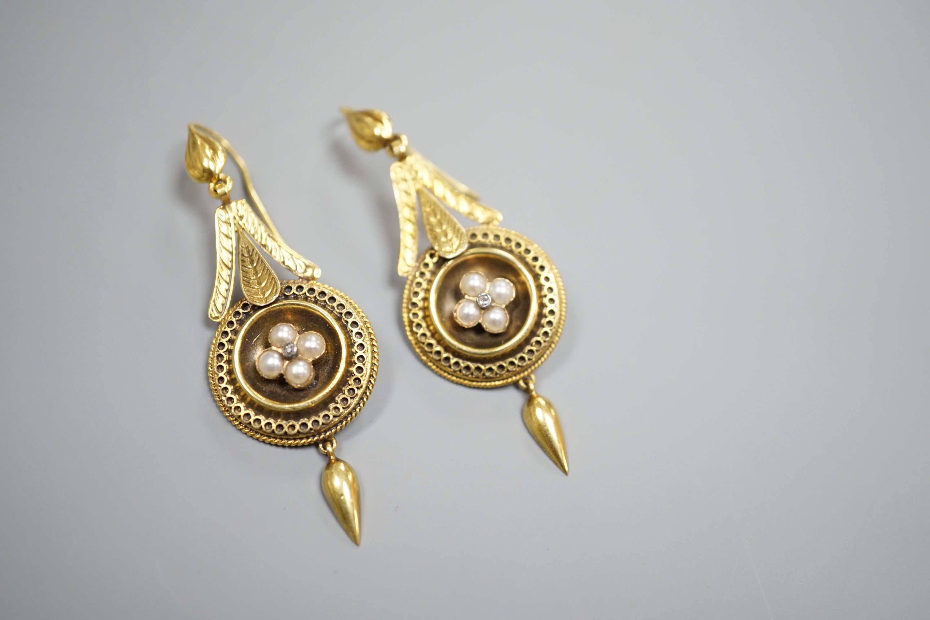 A pair of antique yellow metal, split pearl and diamond chip set drop earrings, overall 54mm, gross weight 5.9 grams.